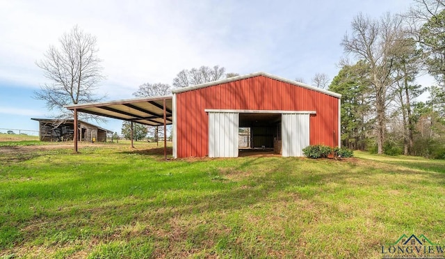 view of outdoor structure with a lawn