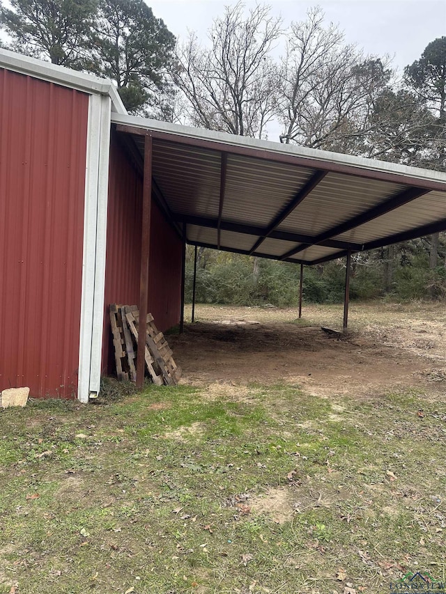 view of outdoor structure with a carport