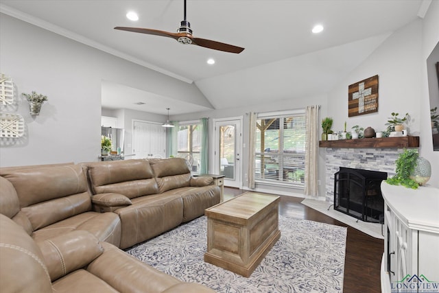 908 Victoria Dr, Longview, TX 75604 - living area with dark wood-style flooring, a stone fireplace, a ceiling fan, recessed lighting, and lofted ceiling
