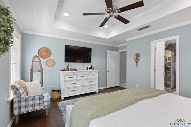 908 Victoria Dr, Longview, TX 75604 - bedroom with visible vents, crown molding, a raised ceiling, baseboards, and dark wood-type flooring