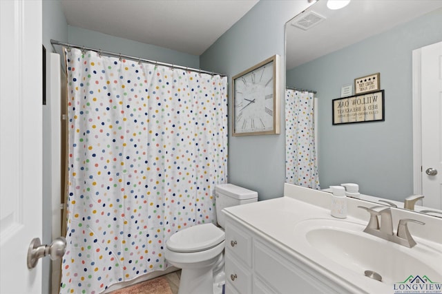 908 Victoria Dr, Longview, TX 75604 - full bathroom featuring vanity, a shower with curtain, toilet, and visible vents