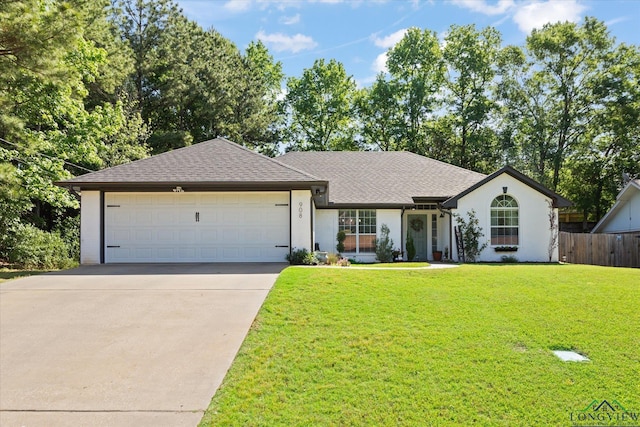 908 Victoria Dr, Longview, TX 75604 - single story home with roof with shingles, a front yard, a garage, fence, and concrete driveway