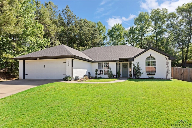 908 Victoria Dr, Longview, TX 75604 - single story home featuring fence, a shingled roof, a garage, a front yard, and concrete driveway