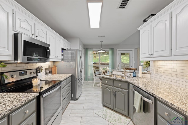 908 Victoria Dr, Longview, TX 75604 - kitchen with a sink, gray cabinets, appliances with stainless steel finishes, and white cabinets