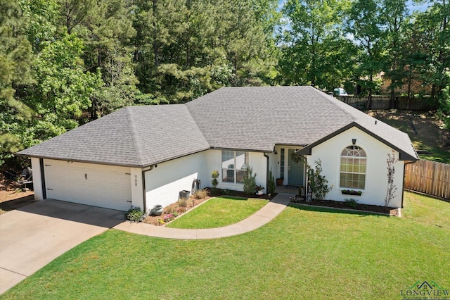 908 Victoria Dr, Longview, TX 75604 - ranch-style house featuring an attached garage, fence, driveway, and a front yard