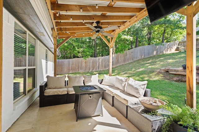 908 Victoria Dr, Longview, TX 75604 - view of patio / terrace featuring a fenced backyard, an outdoor living space with a fire pit, and a ceiling fan