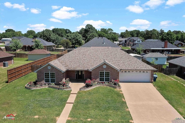 single story home with a front lawn, brick siding, and a garage