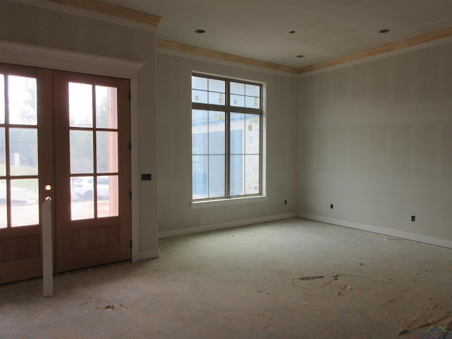 entryway with french doors, a wealth of natural light, and ornamental molding