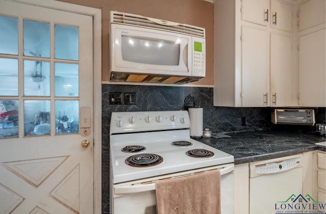 kitchen featuring decorative backsplash and white appliances