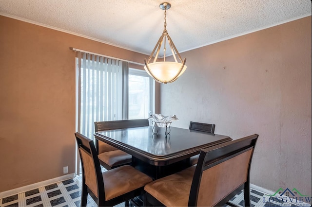 dining space with a textured ceiling