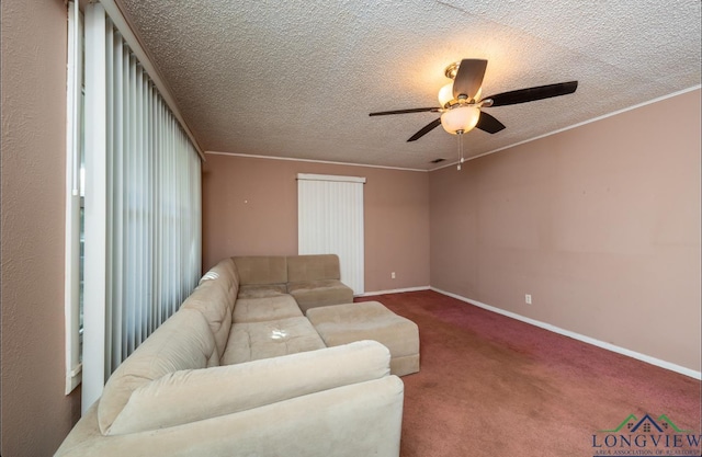 carpeted living room with ceiling fan, ornamental molding, and a textured ceiling