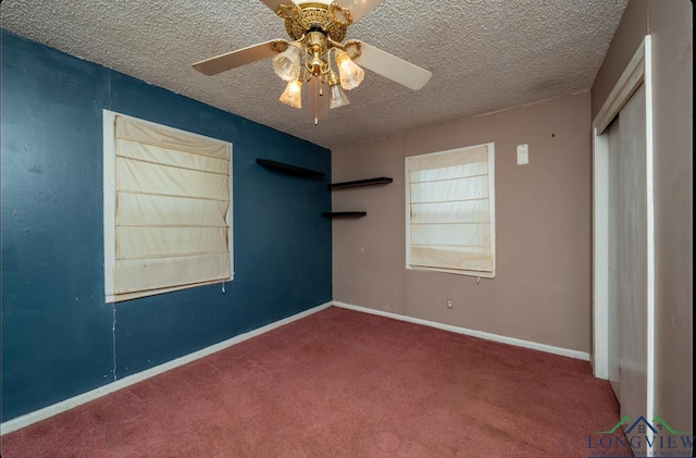 unfurnished bedroom featuring carpet, ceiling fan, and a textured ceiling