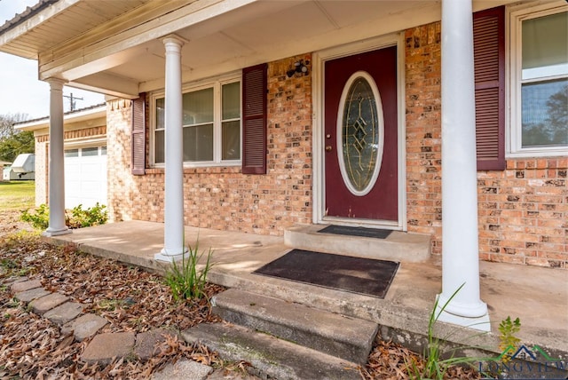 property entrance with covered porch