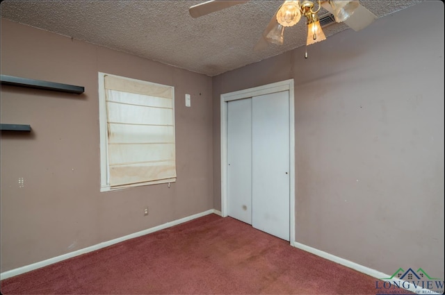 unfurnished bedroom featuring carpet flooring, ceiling fan, a closet, and a textured ceiling