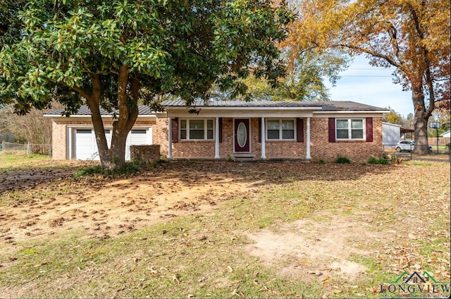 ranch-style home with a porch and a garage