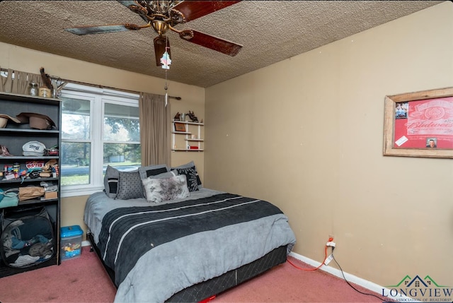 carpeted bedroom with a textured ceiling and ceiling fan