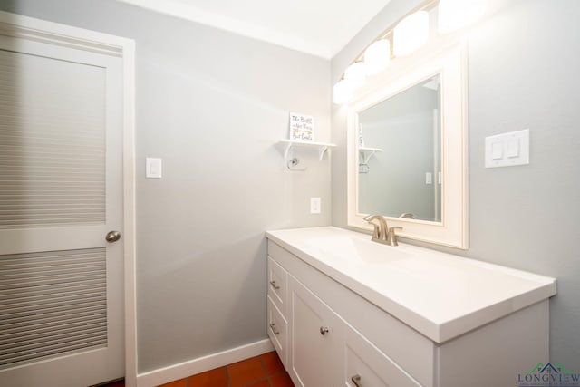 bathroom featuring tile patterned flooring and vanity