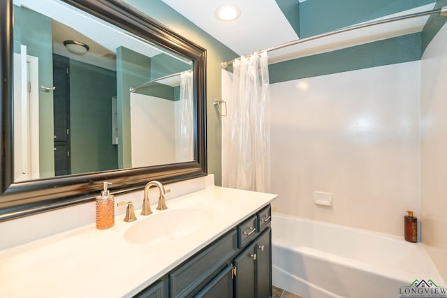 bathroom featuring vanity and shower / bath combination with curtain