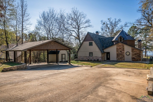 exterior space featuring a carport and a storage shed