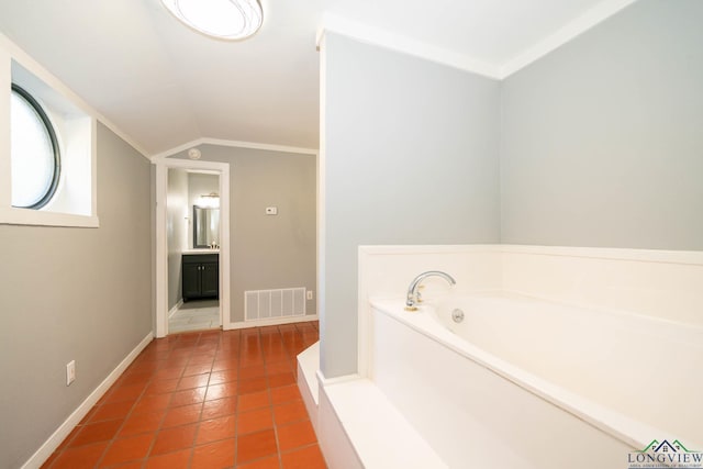 bathroom with vanity, tile patterned floors, vaulted ceiling, ornamental molding, and a tub