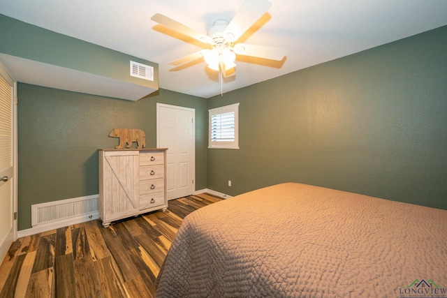 bedroom featuring ceiling fan and dark wood-type flooring