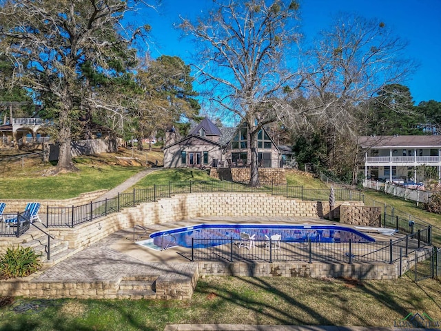 view of pool featuring a yard and a patio