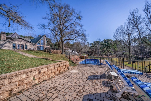 view of patio / terrace featuring a covered pool