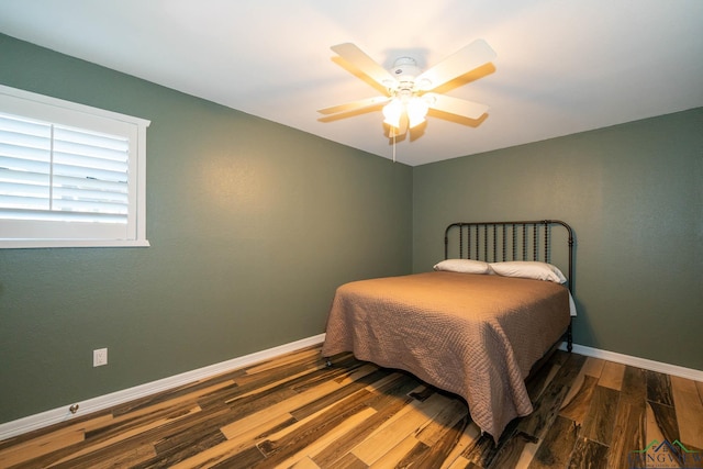 bedroom featuring hardwood / wood-style flooring and ceiling fan