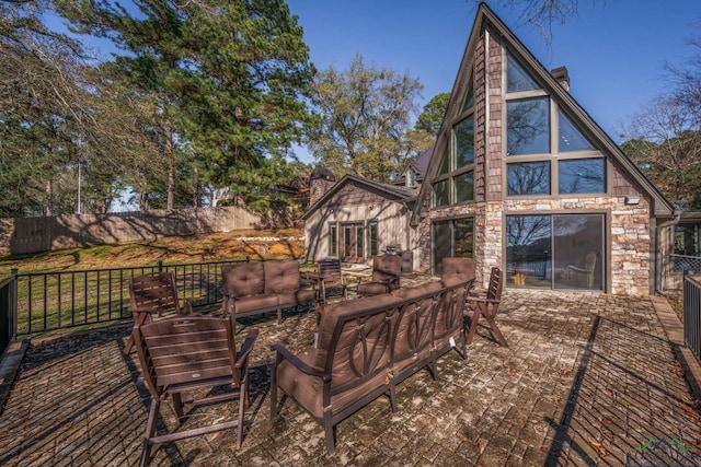 back of house featuring an outdoor living space