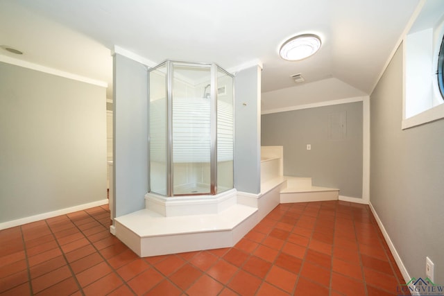 bathroom featuring crown molding and lofted ceiling