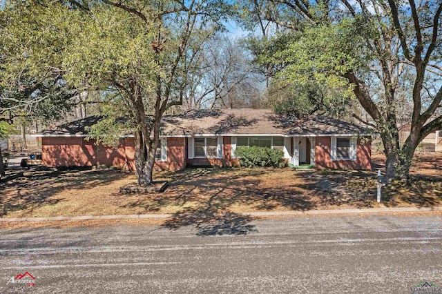 ranch-style house with brick siding