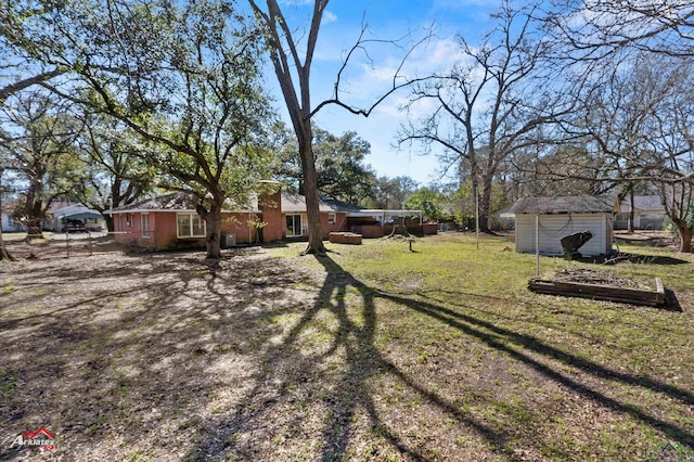 view of yard with a storage unit and an outdoor structure