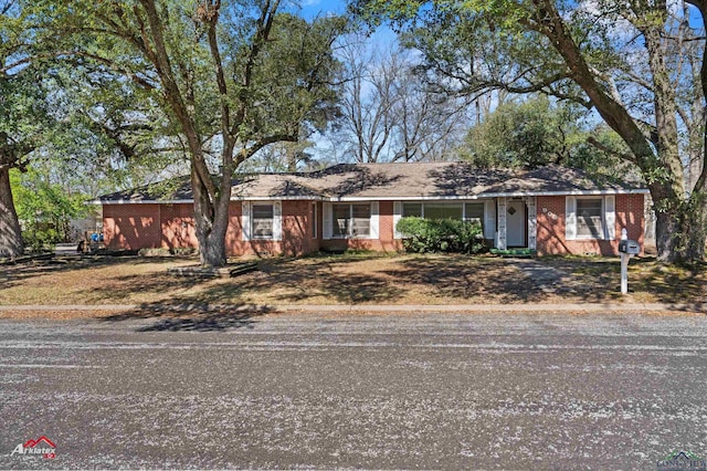 ranch-style house with brick siding