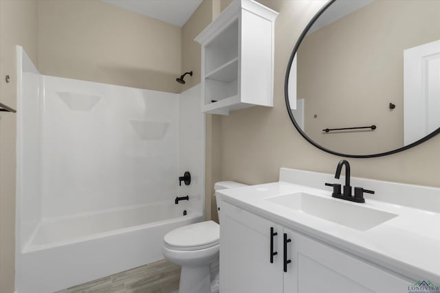 full bathroom with toilet, vanity, and shower / bathtub combination