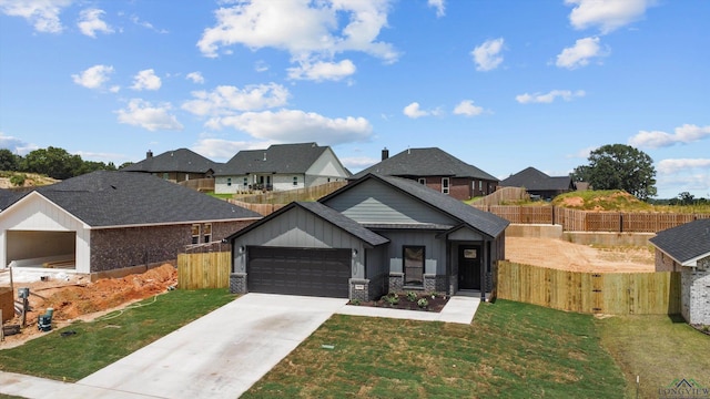 view of front facade featuring a front yard and a garage