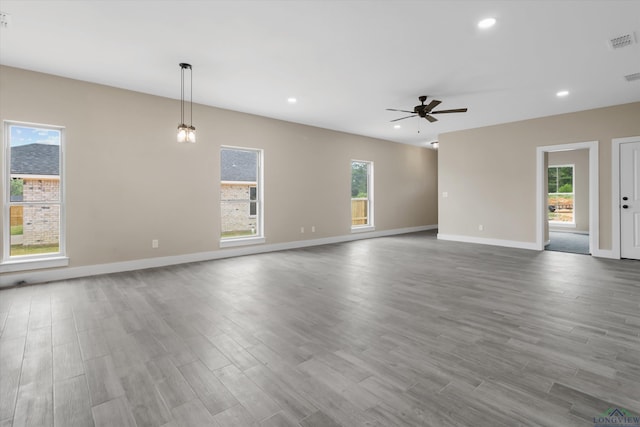 unfurnished living room featuring light wood-type flooring and ceiling fan