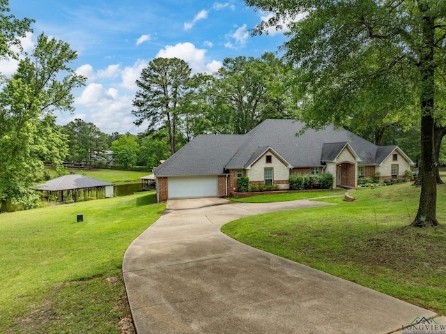 23196 Jeb Cir, Frankston, TX 75763 - traditional-style house featuring concrete driveway, brick siding, a front lawn, and a garage