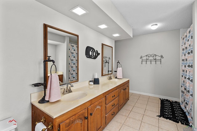 bathroom with tile patterned floors, vanity, and toilet