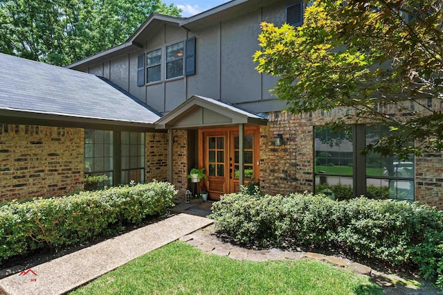 view of exterior entry featuring french doors