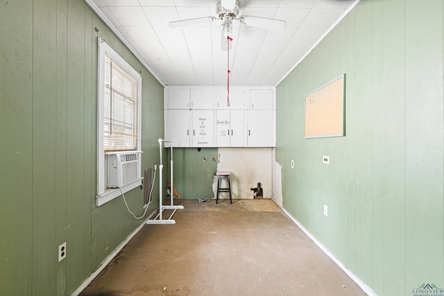 2707 Dudley Rd, Kilgore, TX 75662 - washroom featuring cooling unit, ceiling fan, and wood walls