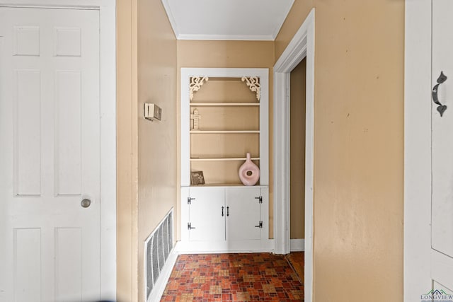 2707 Dudley Rd, Kilgore, TX 75662 - laundry room featuring ornamental molding and brick patterned floors