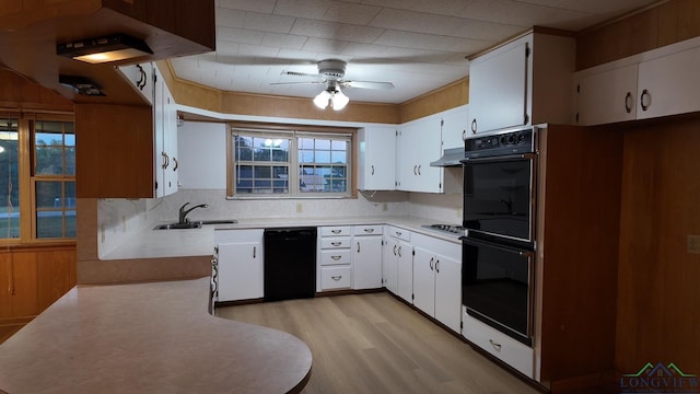 kitchen featuring white cabinets, sink, ceiling fan, and black appliances