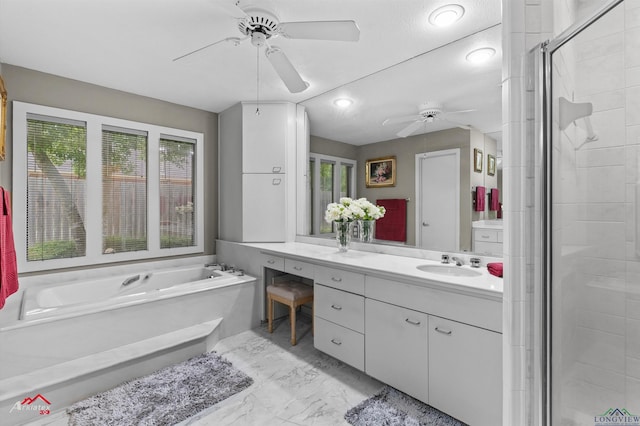 301 Tealwood Dr, Longview, TX 75605 - bathroom featuring ceiling fan, vanity, a bath, and healthy amount of natural light