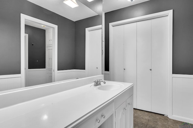 bathroom featuring wainscoting and vanity