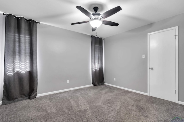 unfurnished bedroom featuring ceiling fan, baseboards, and carpet
