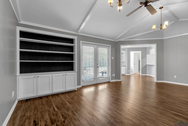 unfurnished living room with ceiling fan with notable chandelier, lofted ceiling with beams, baseboards, and dark wood finished floors