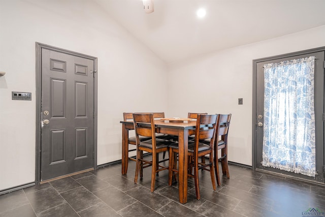 dining room with lofted ceiling