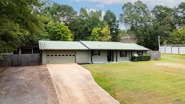 ranch-style house with a front lawn, covered porch, and a garage