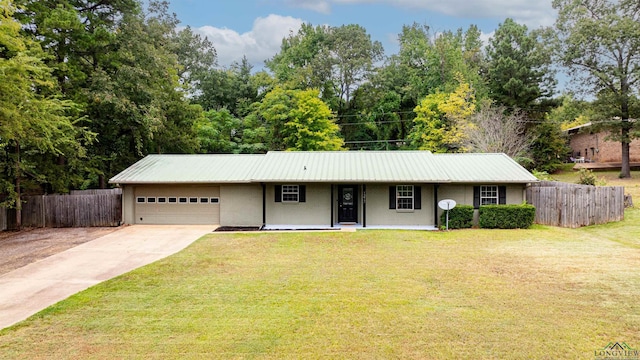 ranch-style house with a garage and a front lawn