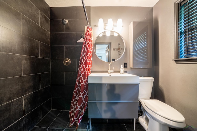 bathroom with tile patterned floors, vanity, a shower with shower curtain, and toilet